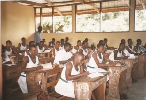 STUDENTS OF SAMPA RC JUNIOR HIGH SCHOOL FORM TWO 'A' IN CLASS AFTER THE RENOVATION OF THEIR BLOCK.